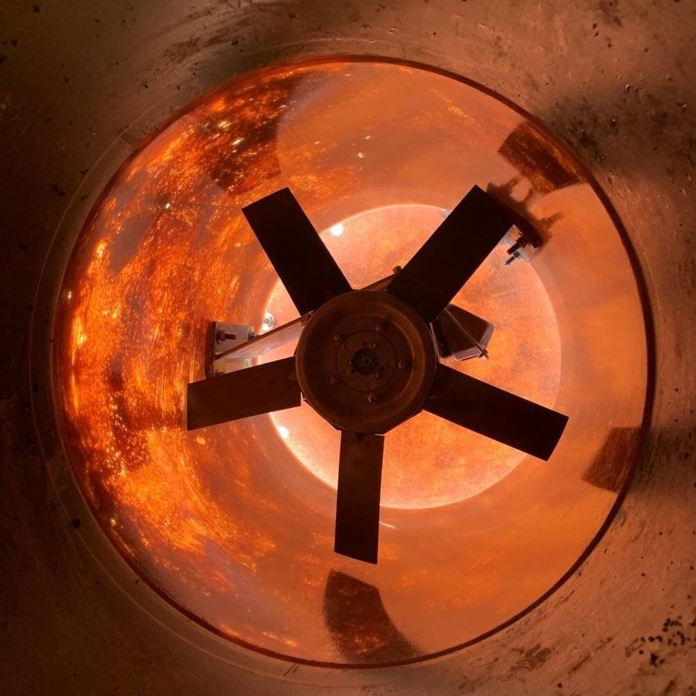 Looking up inside an aerator vessel at the blower fan blades