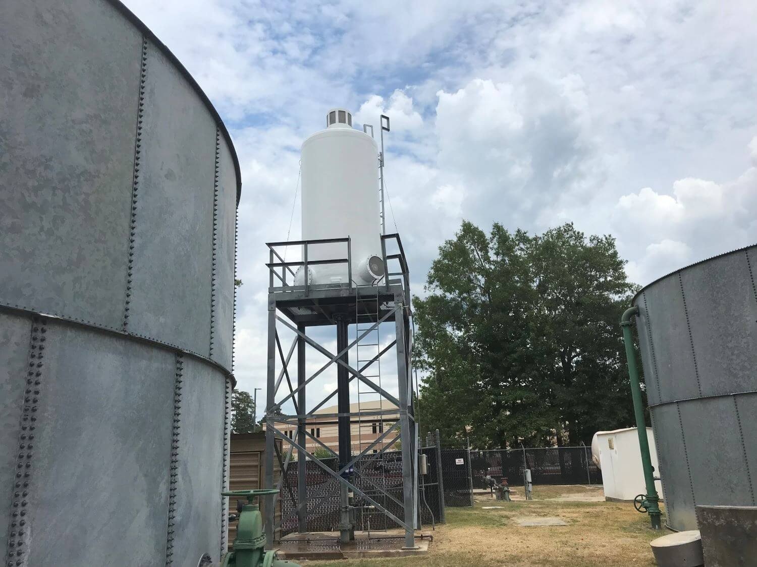 Elevated WETS aerator on a steel tower between galvanised storage tanks