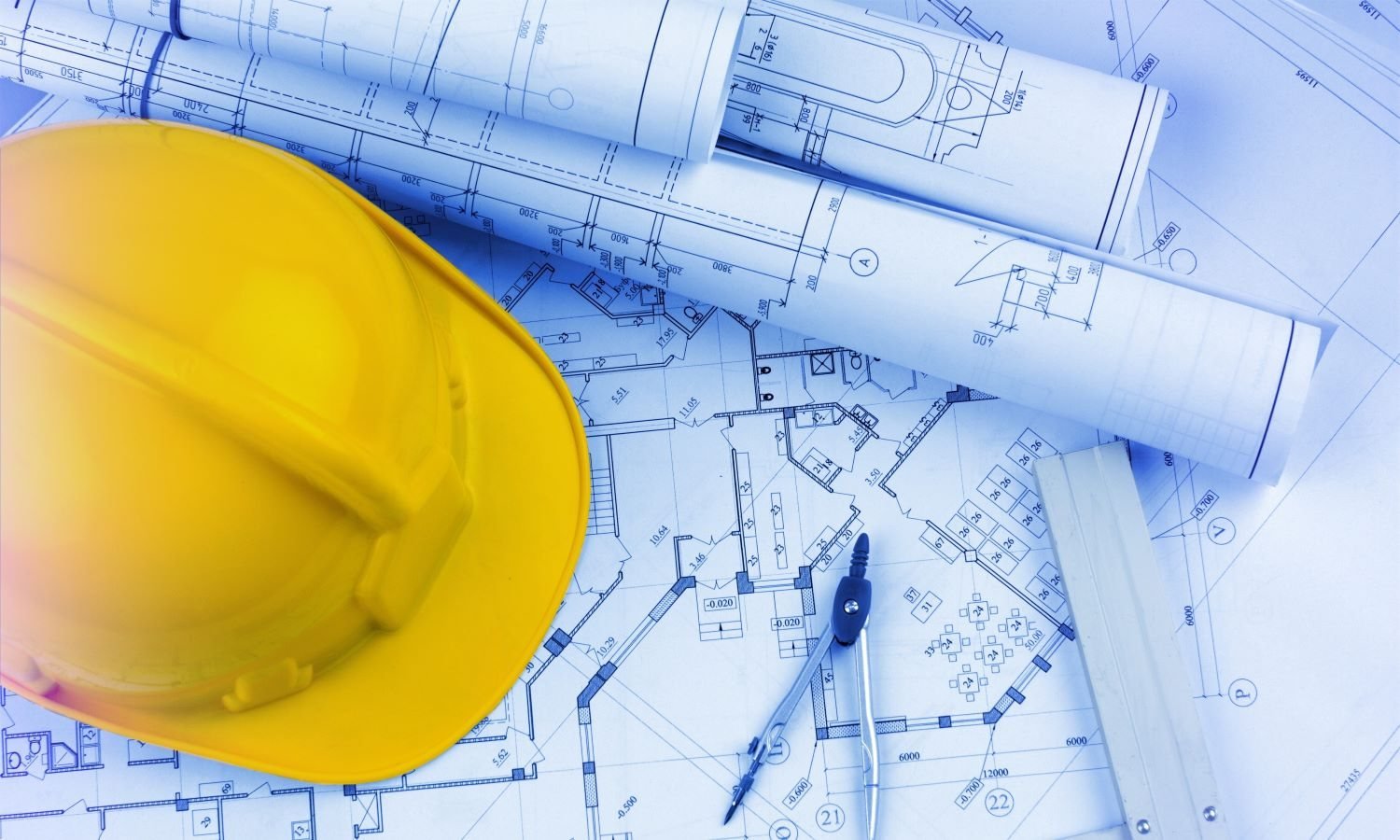 Engineering drawings and site helmet representing the WETS engineering team