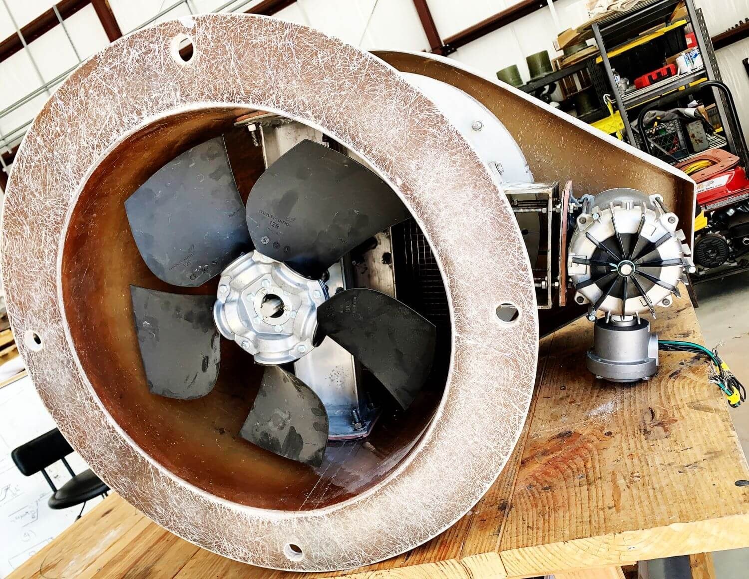 Ventilation fan and motor assembly on the workbench during service