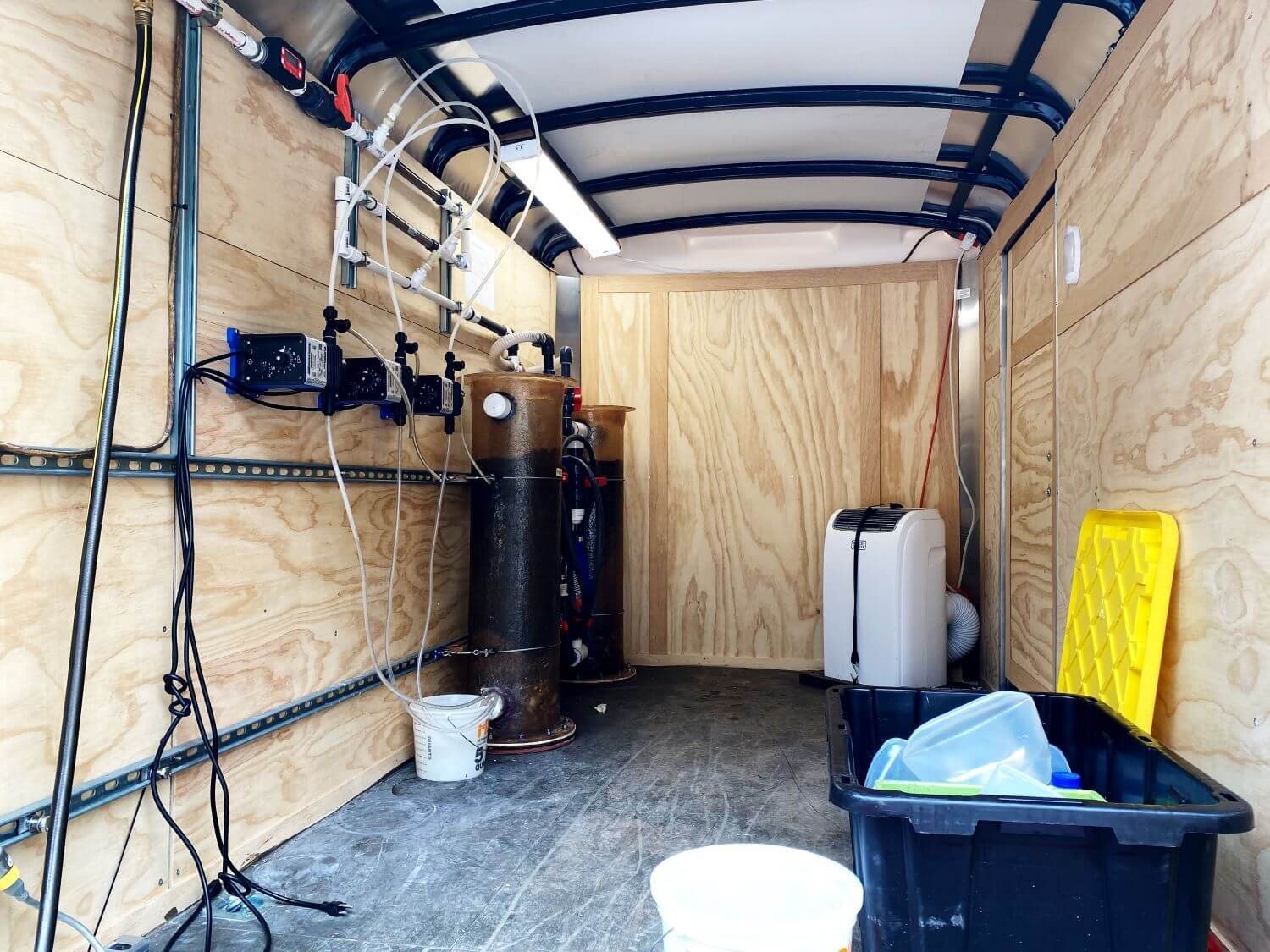 Interior of the WETS enclosed pilot trailer with dosing pumps, media columns and control gear